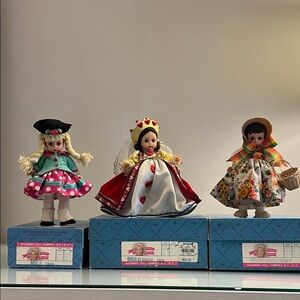 Madame Alexander Dolls in Red, Teal, and Floral Outfits